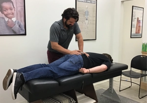 Chiropractor Mt. Juliet TN Evan Pridmore Adjusting A Patient